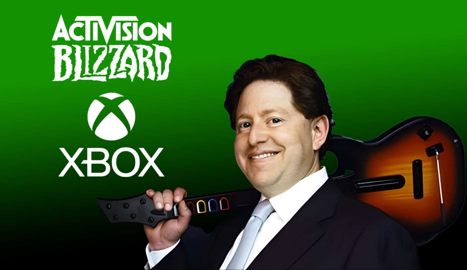 Homem sorrindo de terno segurando um controle de guitarra, com os logotipos da Activision Blizzard e do Xbox ao fundo em tons de verde
