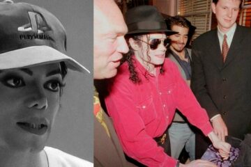 Michael Jackson jogando Tekken em um fliperama durante o lançamento do PlayStation 1 na E3 de 1995, usando um boné com o logotipo do PlayStation