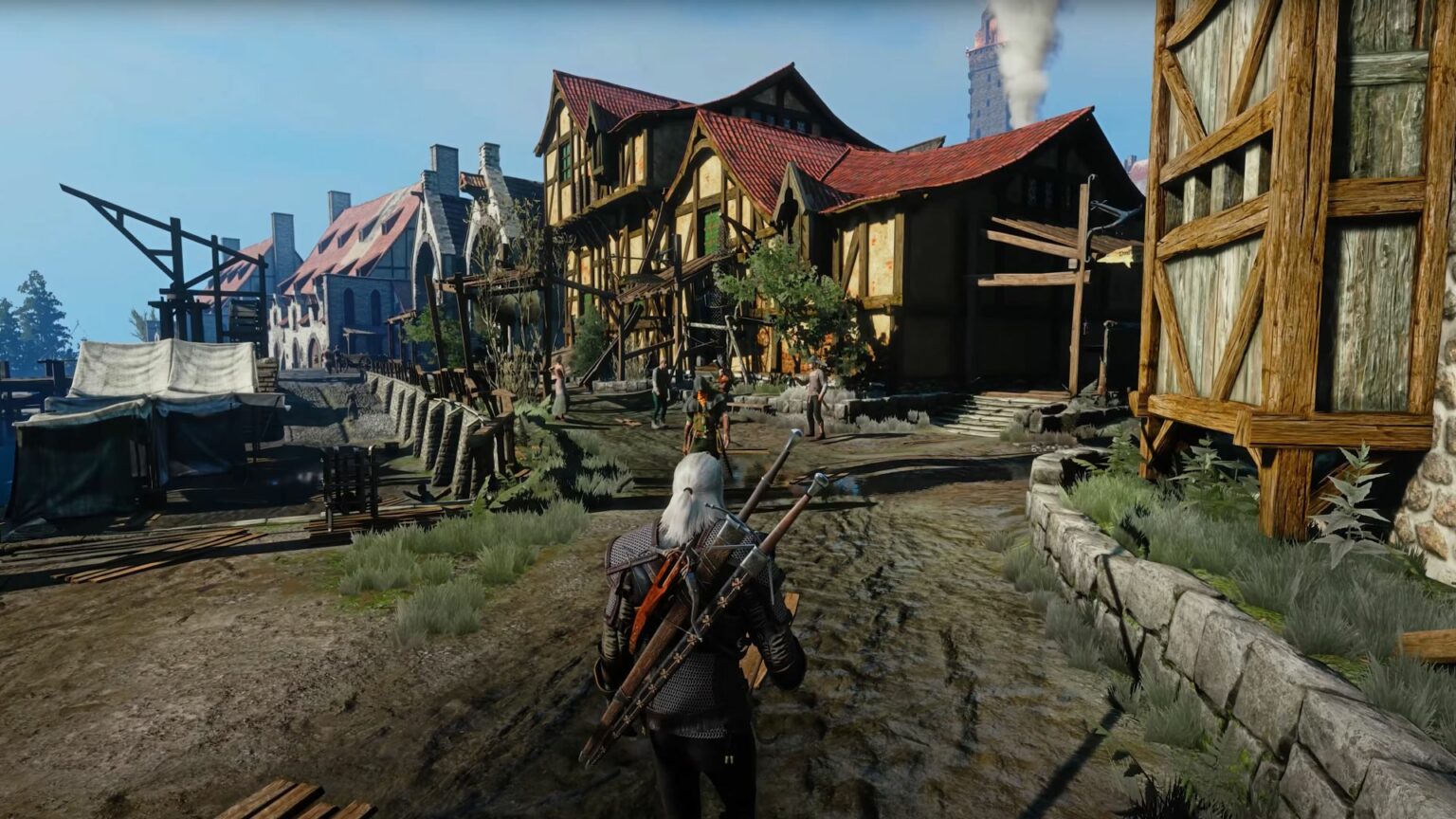 Captura de cena do jogo The Witcher 3 mostrando Geralt de Rívia caminhando por uma vila medieval de casas de madeira com telhados vermelhos e iluminação realis…
