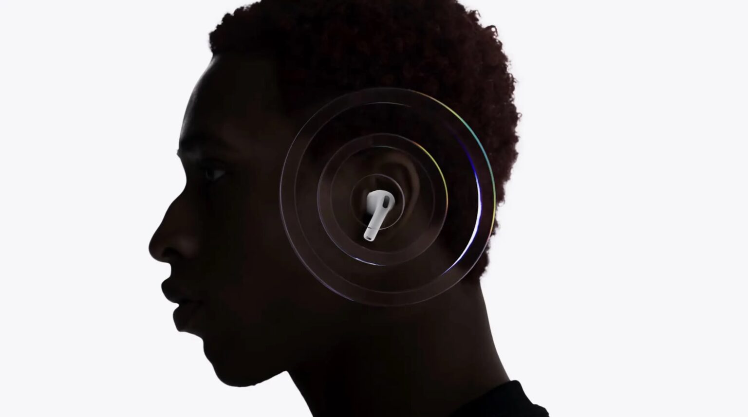 Perfil de pessoa em silhueta escura com um fone AirPods Pro branco no ouvido, cercado por anéis de cancelamento de ruído em fundo claro