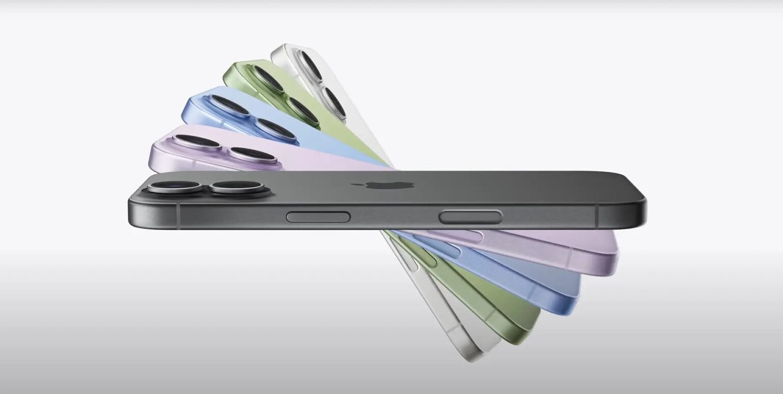 iPhone 16 em cinza espacial e em cores pastel como roxo, azul, verde e branco, dispostos em leque sobre fundo claro