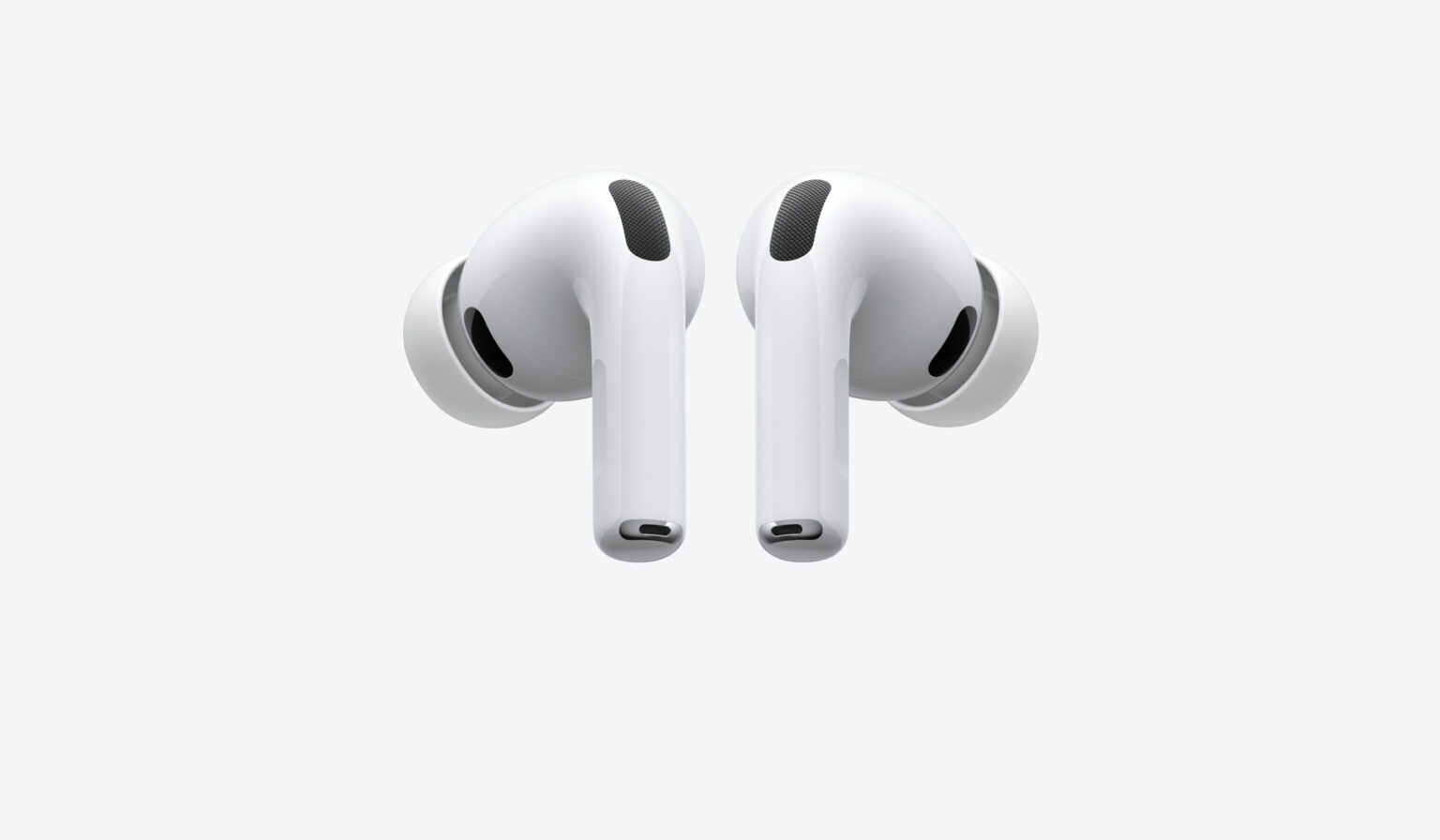 Par de fones AirPods Pro 3 brancos, com hastes voltadas para baixo, sobre fundo cinza claro