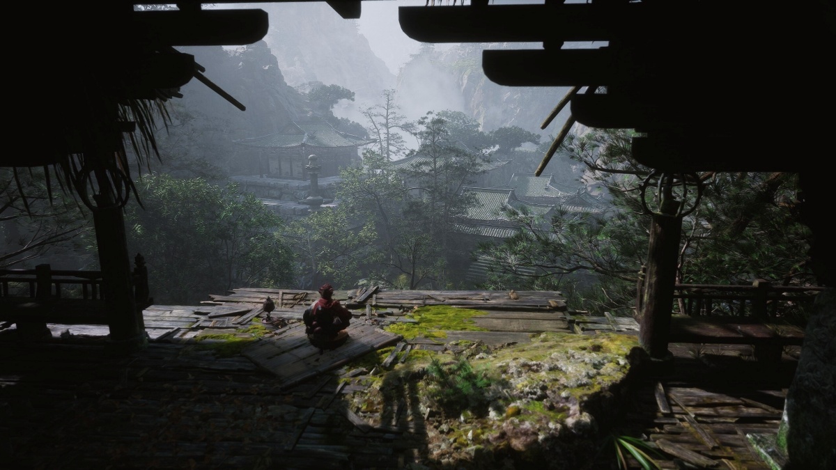 Black Myth: Wukong impulsiona turismo histórico na China e gera milhões 1 Figura sentada de roupagem vermelha contemplando paisagem tradicional chinesa com varanda antiga e montanhas enevoadas ao fundo