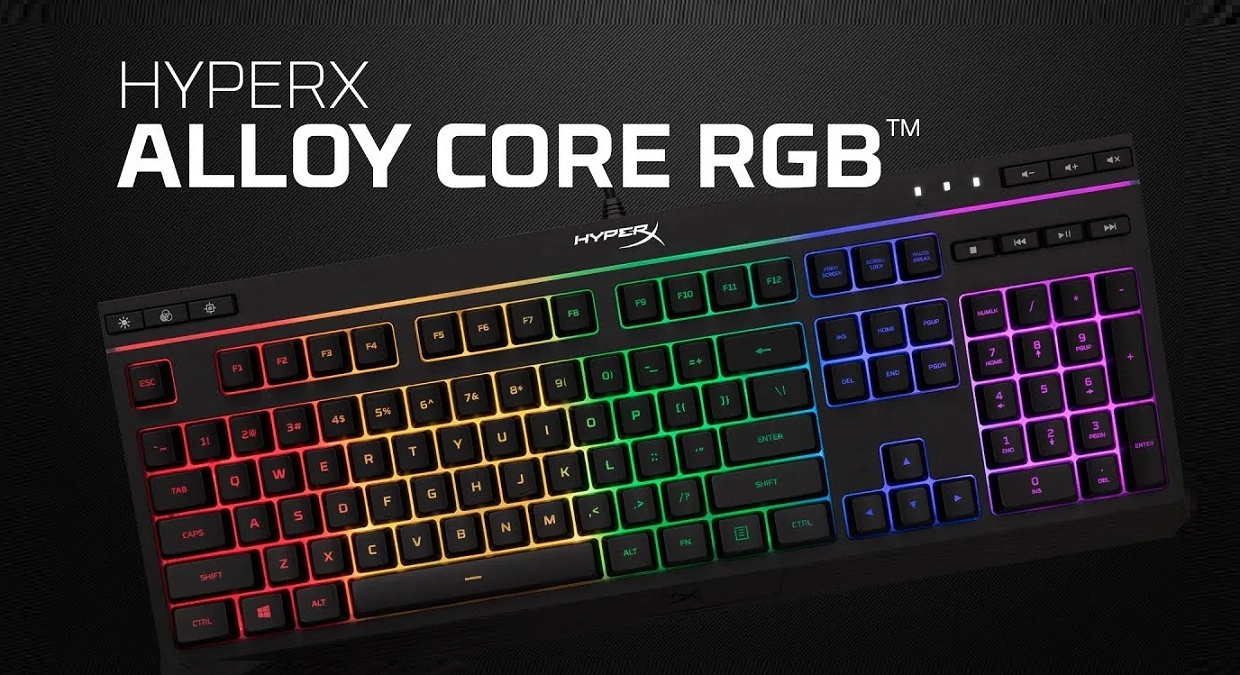 Teclado gamer HyperX Alloy Core RGB preto com iluminação RGB multicolorida nas teclas, exibido sobre fundo escuro com o nome do modelo em destaque