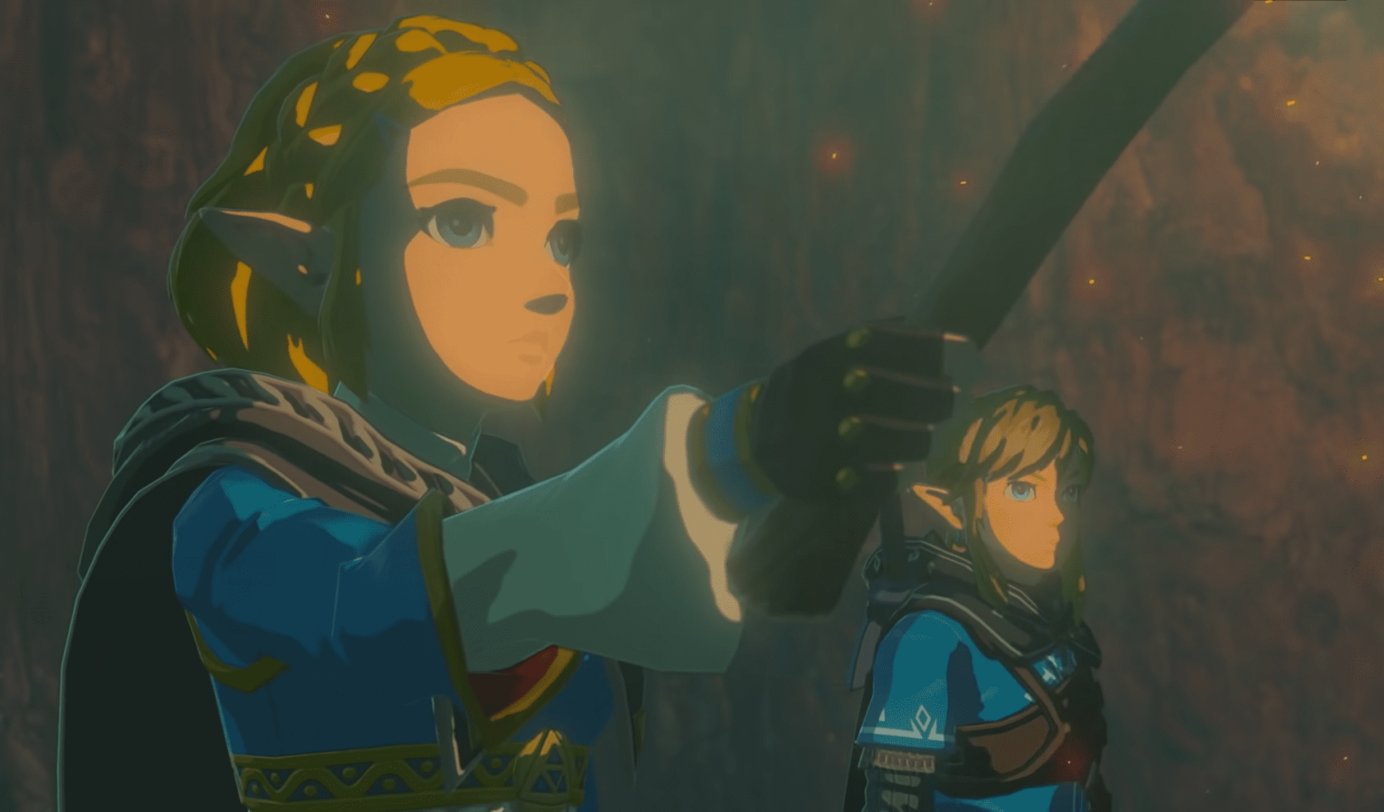 Zelda e Link em cena de The Legend of Zelda: Tears of the Kingdom, com Zelda apontando à frente enquanto Link observa ao lado
