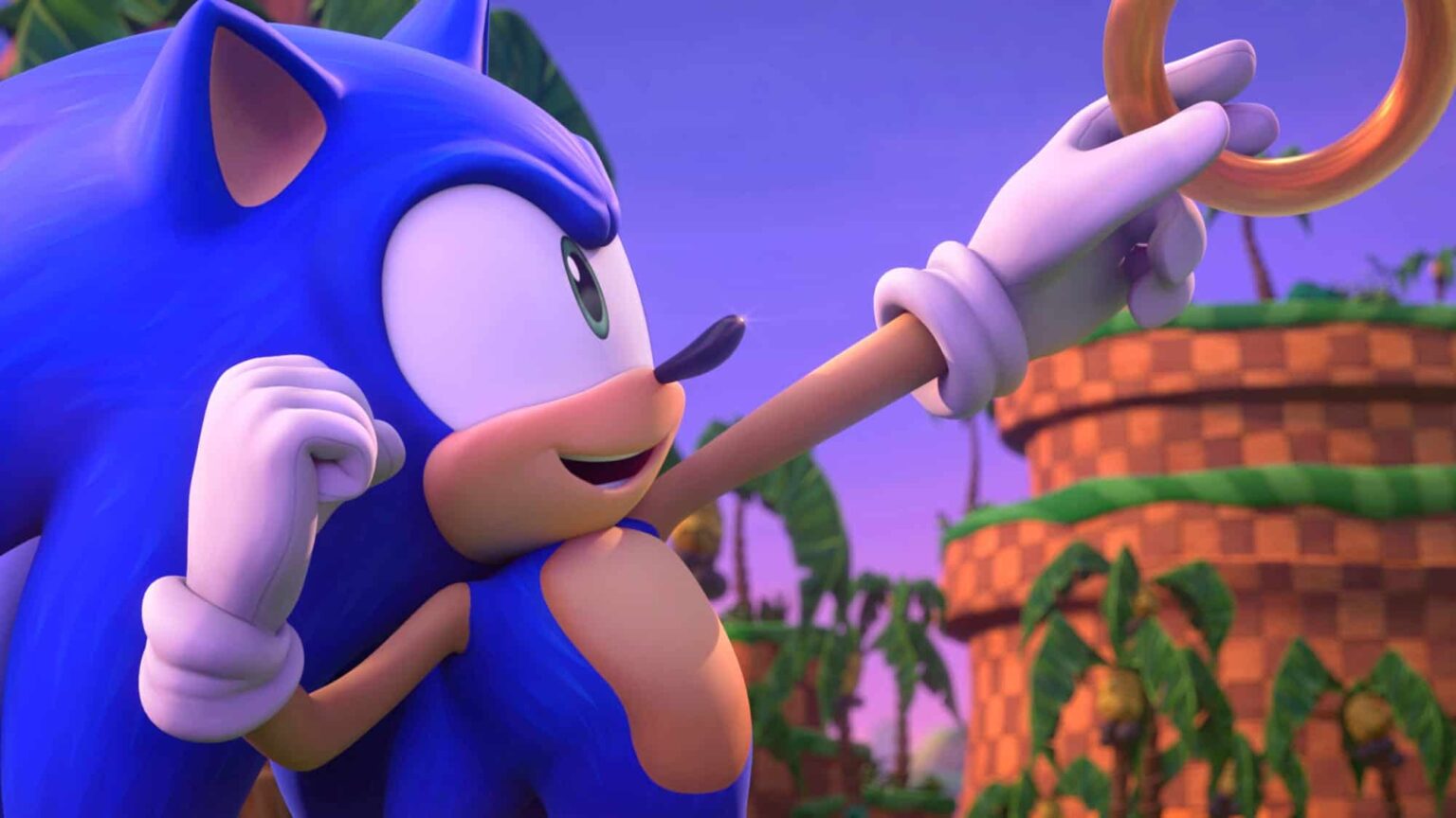 Sonic, personagem azul da SEGA, pegando um anel dourado em um cenário de fase verde com palmeiras e colinas xadrez, em cena 3D da série Sonic Prime