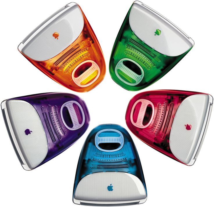 Cinco computadores iMac G3 em cores translúcidas (laranja, verde, roxo, vermelho e azul), dispostos em círculo sobre fundo branco