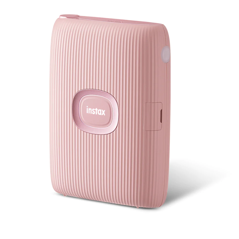 Impressora portátil Instax Mini Link 2 da Fujifilm, na cor rosa, com botão central e logotipo instax
