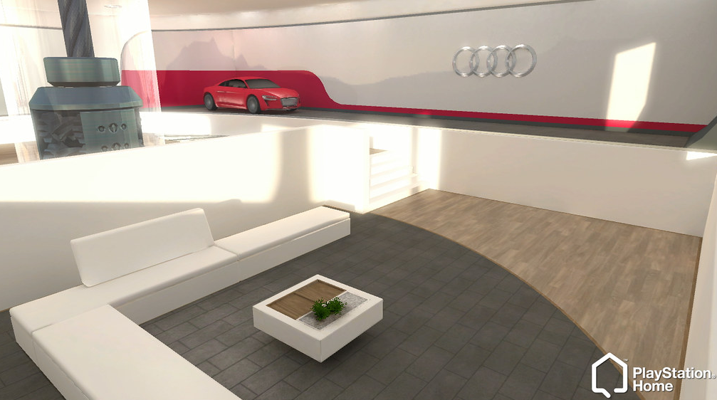 Ambiente 3D do PlayStation Home com sofá branco, mesa de centro e um carro vermelho Audi exposto ao fundo, com o logo das quatro argolas na parede