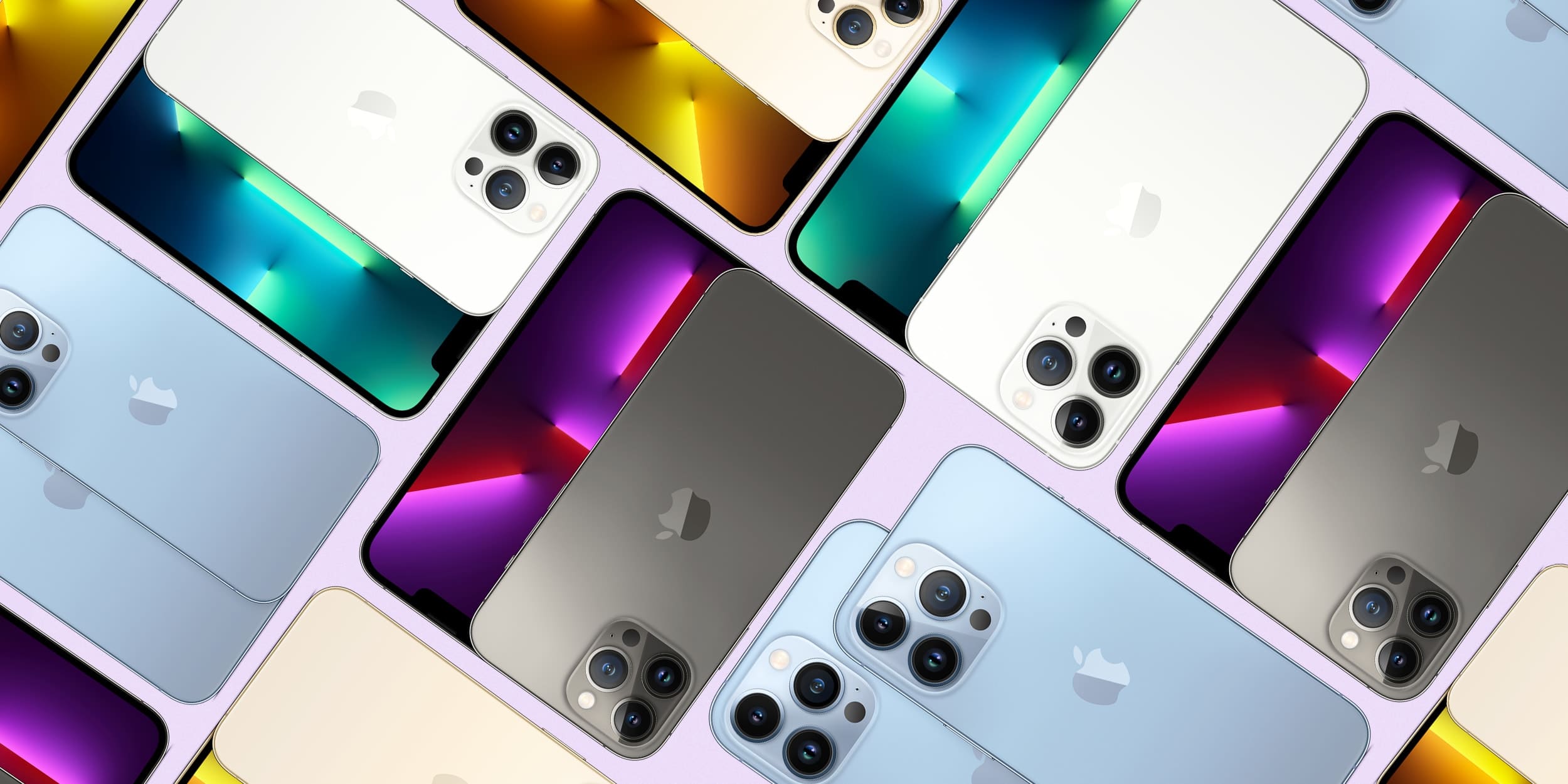 Diversos iPhone 13 Pro em cores diferentes, dispostos em diagonal, mostrando as traseiras e os conjuntos de câmeras e as telas com papéis de parede coloridos
