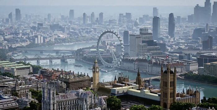 Vista aérea de Londres com o London Eye, o Rio Tâmisa, pontes e o Palácio de Westminster com o Big Ben em primeiro plano