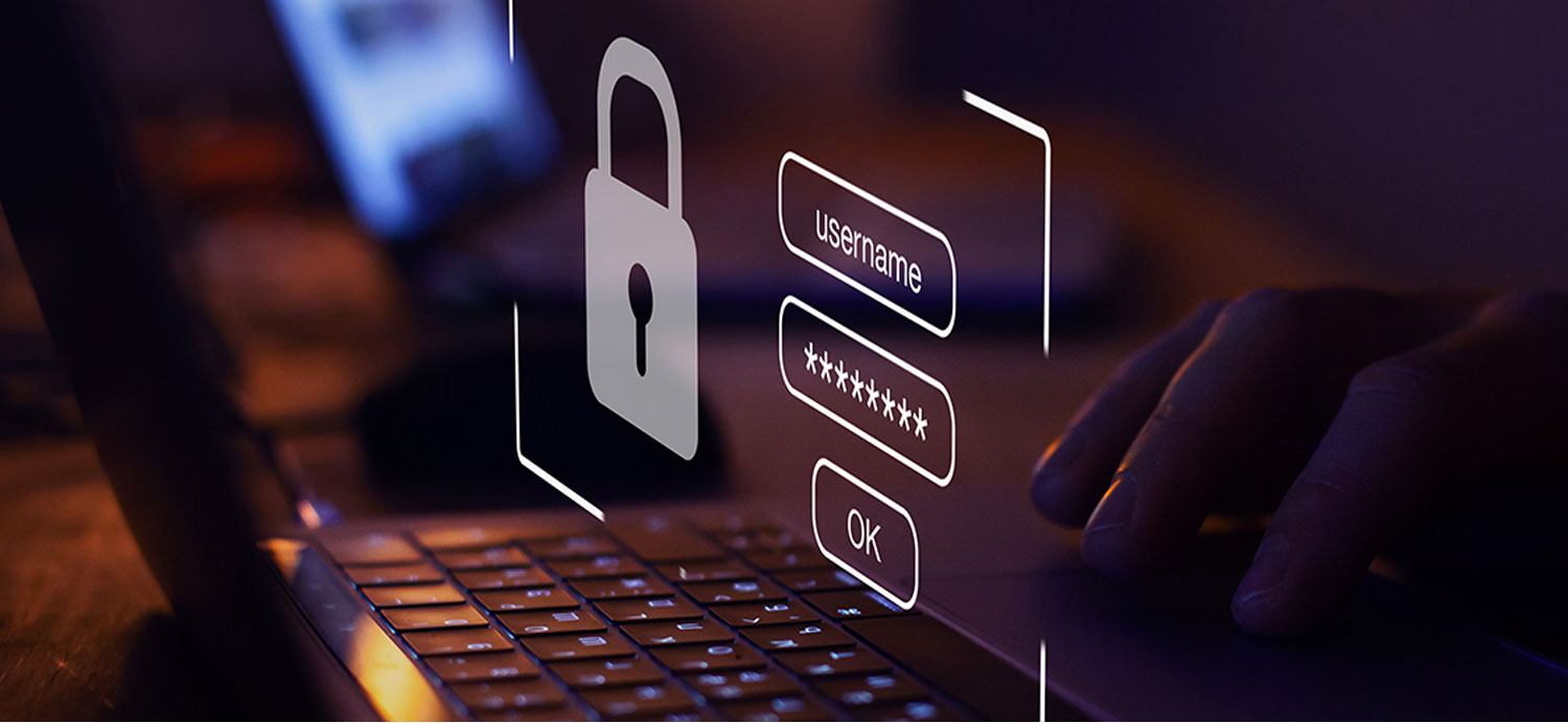 Mão digitando em notebook ao lado de um ícone de cadeado e campos de login com "username", senhas mascaradas e botão OK em holograma