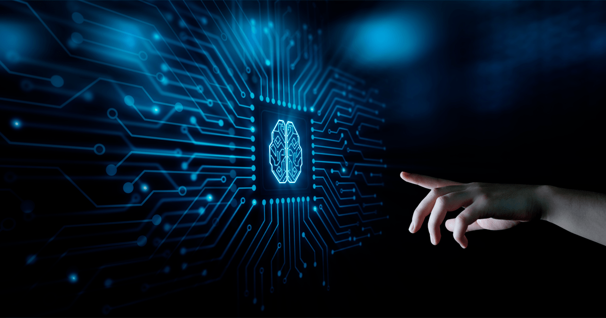 Mão estendida em direção a um circuito azul luminoso com um ícone de cérebro no centro, representando inteligência artificial